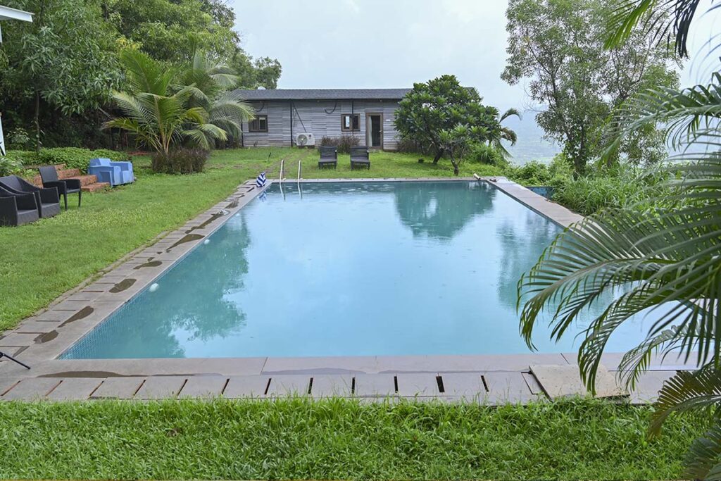 wooden villa antiques poolside infinity pool hill view